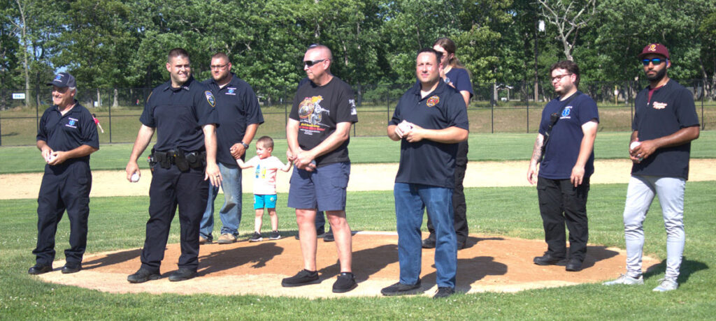 First responders from the Town of Riverhead throw out the first pitch at June 12th Tomcats home opener