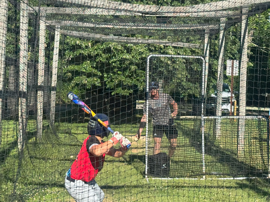 Little League All Star taking swings in the batting cage